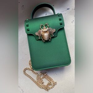 Green mini bag with gold bee accent